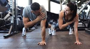 Toning Bingo Wings: Your Ultimate Guide to Sculpting Sleek Arms at the Gym 3 Fitness trainer demonstrating arm toning exercises Ayr