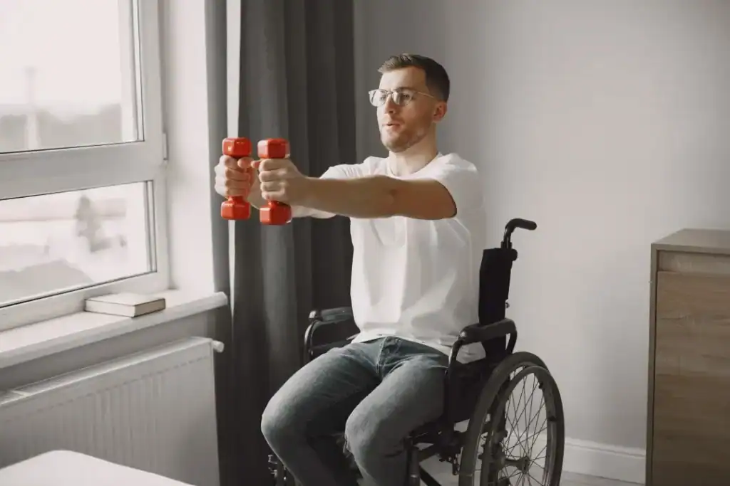 Image of man doing exercise in his wheelchair to aid weight loss Ayr