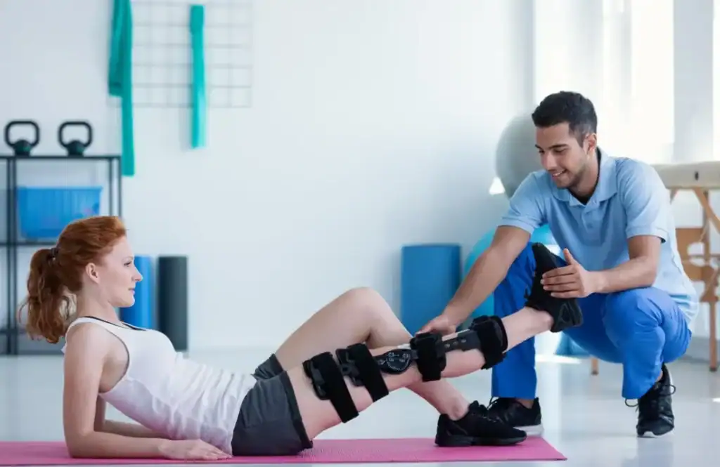 Debunking Meal Timing Myths: The Truth About Muscle Recovery 1 Woman having treatment to help muscle recovery Ayr after an injury