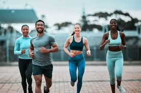 Sculpting Sleek Arms: The Essential Role of Cardio in Toning Without Bulking Up 3 image of people running to incorporate cardio Ayr exercise into their life to help tone arms and body.